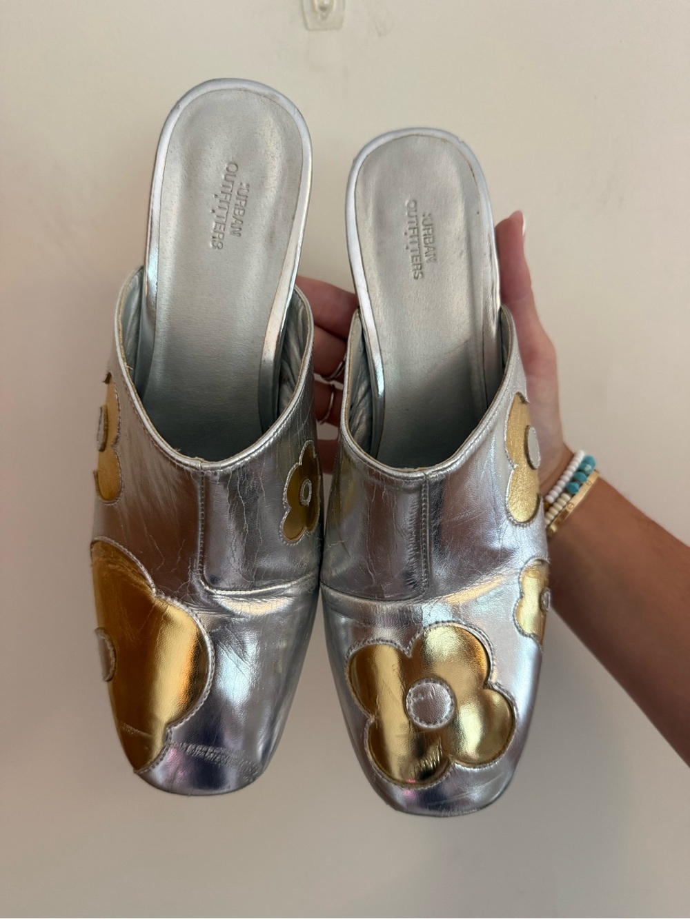 Urban Outfitters Silver Slip-On Mules with Gold Floral Appliqués
